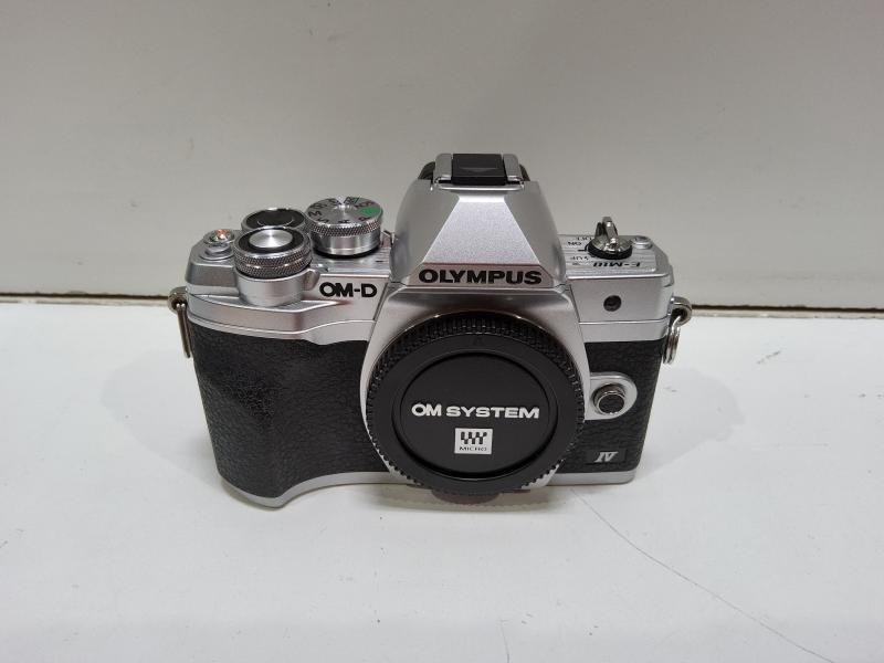 Olympus OM-D E-M10 Mark IV Camera with ED 14-42mm F3.5-5.6 EZ Lens, Silver - MSRP $799