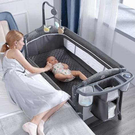 BabyBond Baby Bassinet Bedside Crib with Sheet, Diaper Changing Table and Music Mobile - MSRP $169